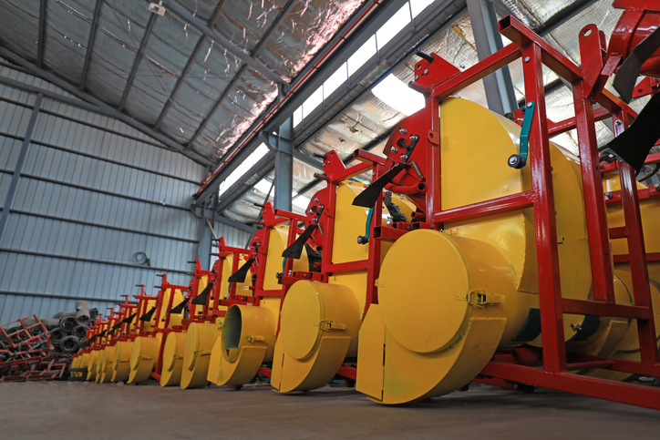 OEM solutions need to be comprehensive and consistent, as shown by the row of yellow agricultural equipment