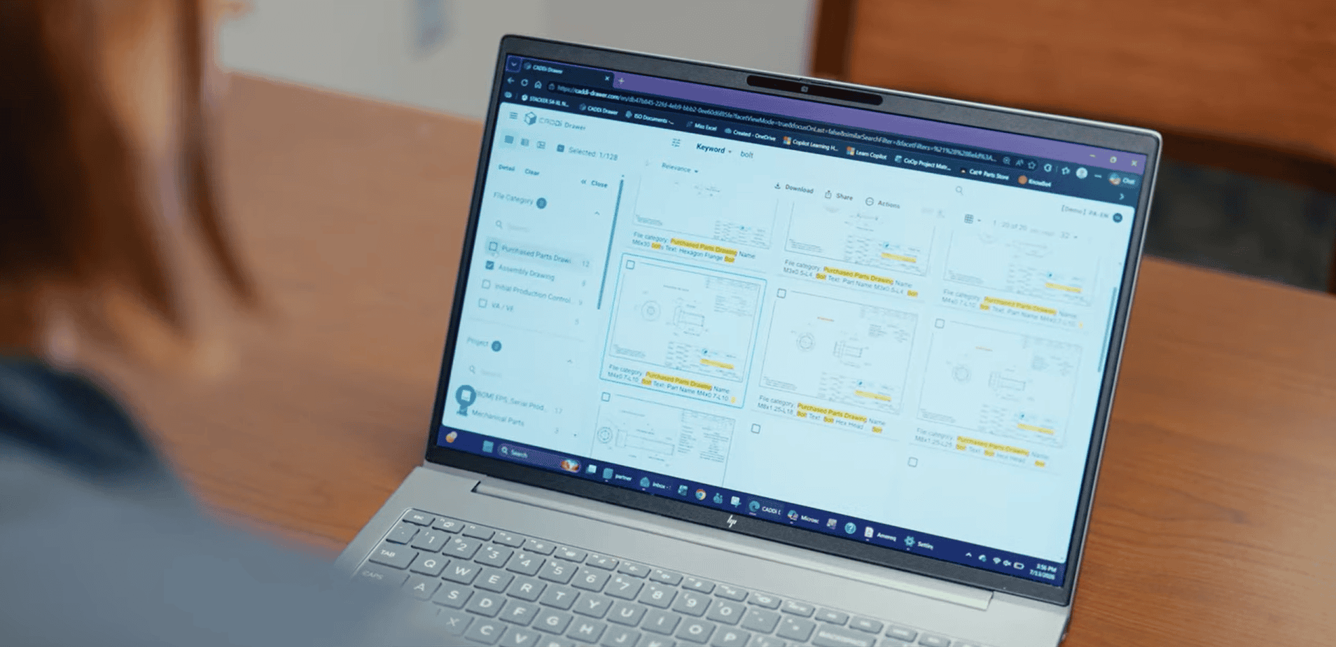 An Amerequip team member searches for relevant part data across platforms with CADDi tools